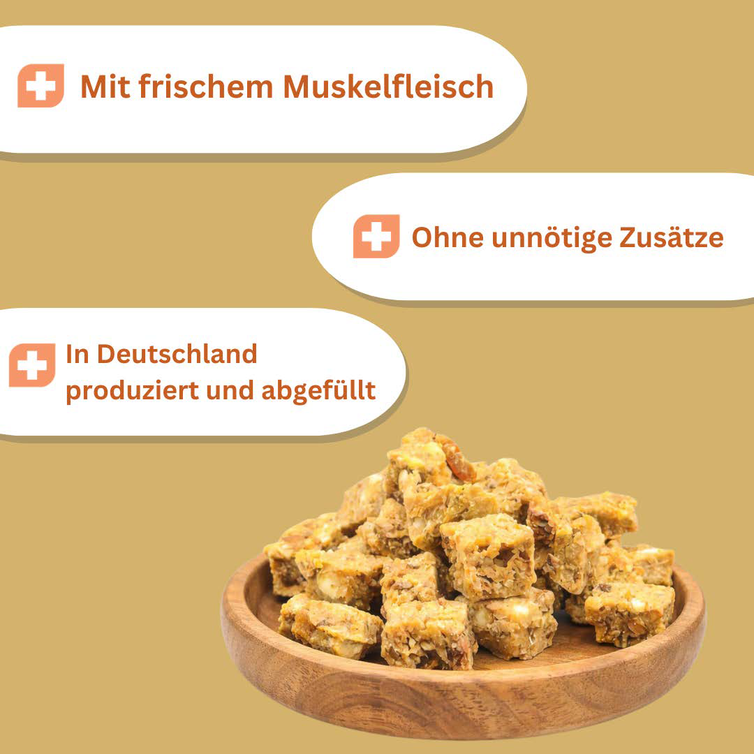 Schüssel mit herzhaften Snackies; Textfelder: "Mit frischem Muskelfleisch", "Ohne unnötige Zusätze", "In Deutschland produziert und abgefüllt".